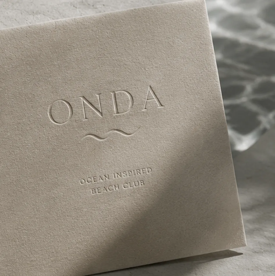 Onda beach club identity reference with a coastal portrait
